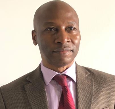 Dr. Dennis Ufot, Chief Operating Officer